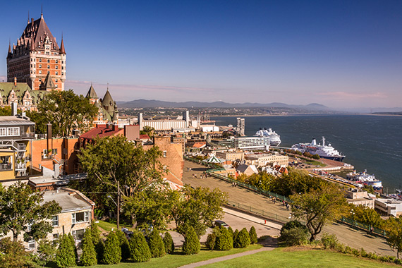 View of Québec from the Château Frontenac showing the port and its boats, the river running along the northern and southern shores.